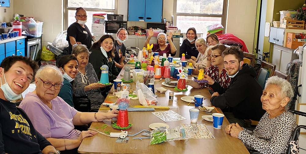 Group-of-students-accompanied-by-Focus-Missionaries-for-Mission-work-in-Gallup-helps-our-Residents-to-make-centerpieces-for-Easter